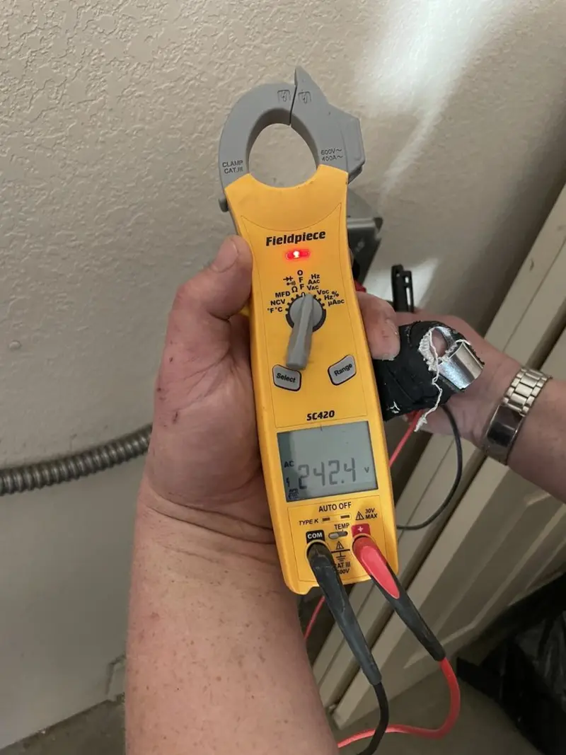 Voltage testing with clamp meter during Generator Installation in Forrest City